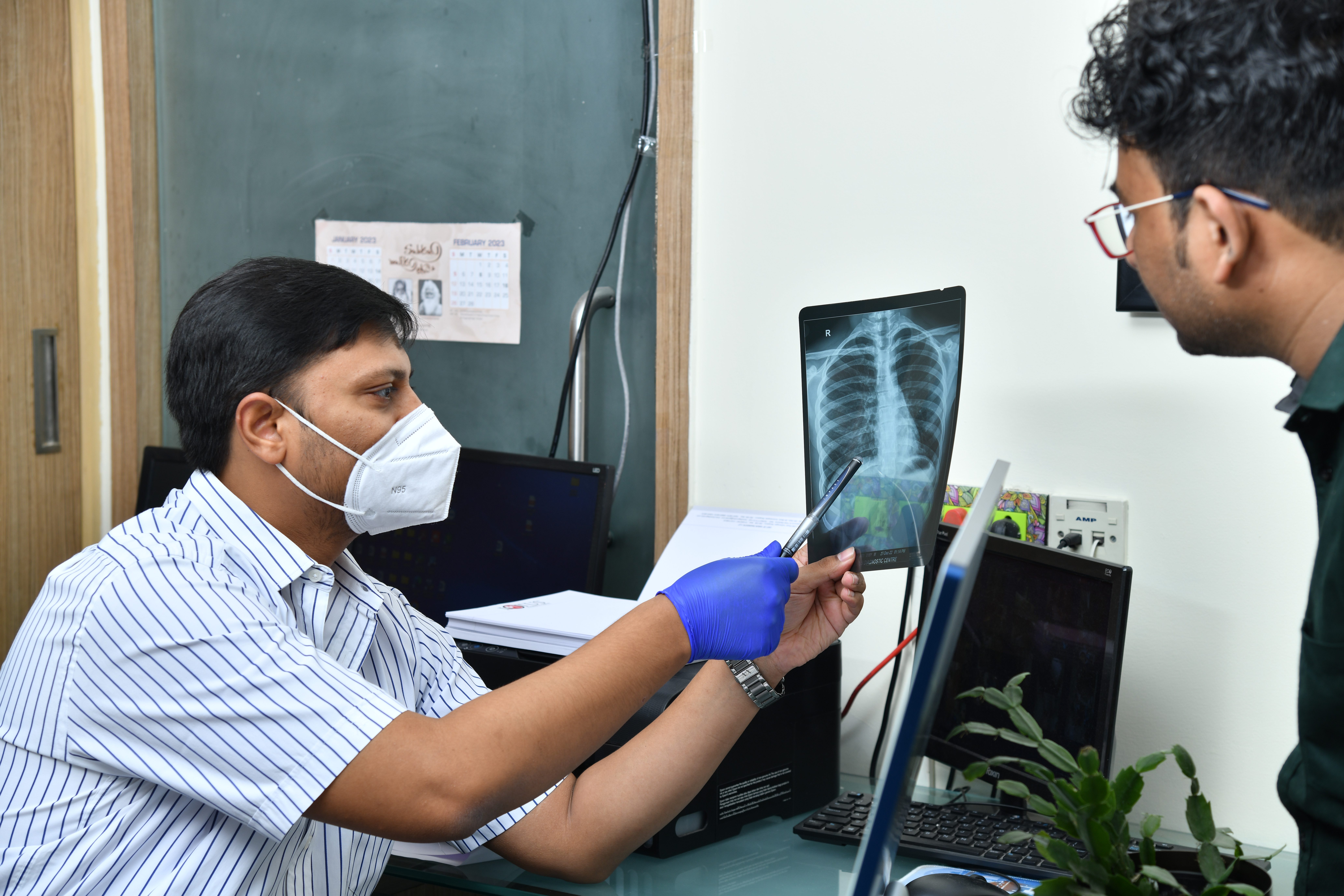 Doctor Explaining X-Ray to Patient